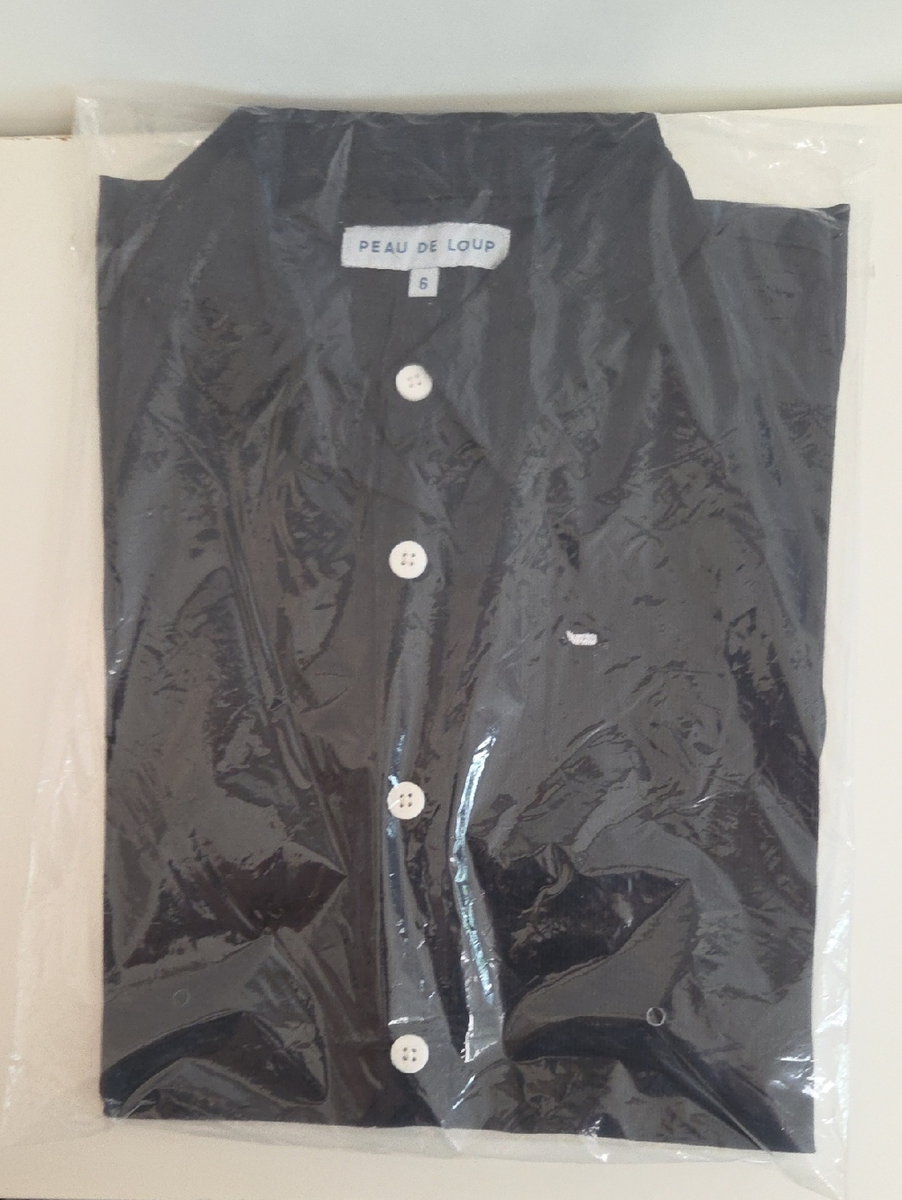 Peau De Loup Black Shirt with Contrasting White Buttons